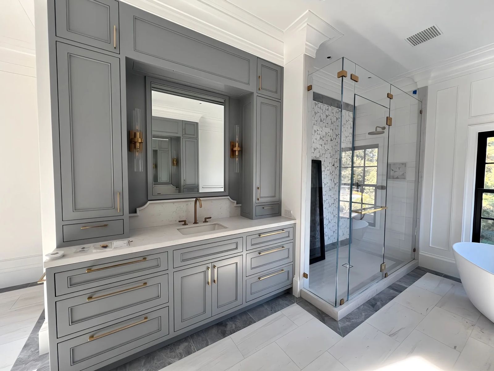 Bathroom with painted gray vanity cabinets and white paneled walls