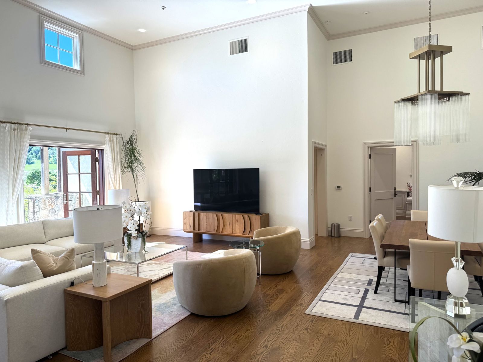 Living and dining room with high ceilings