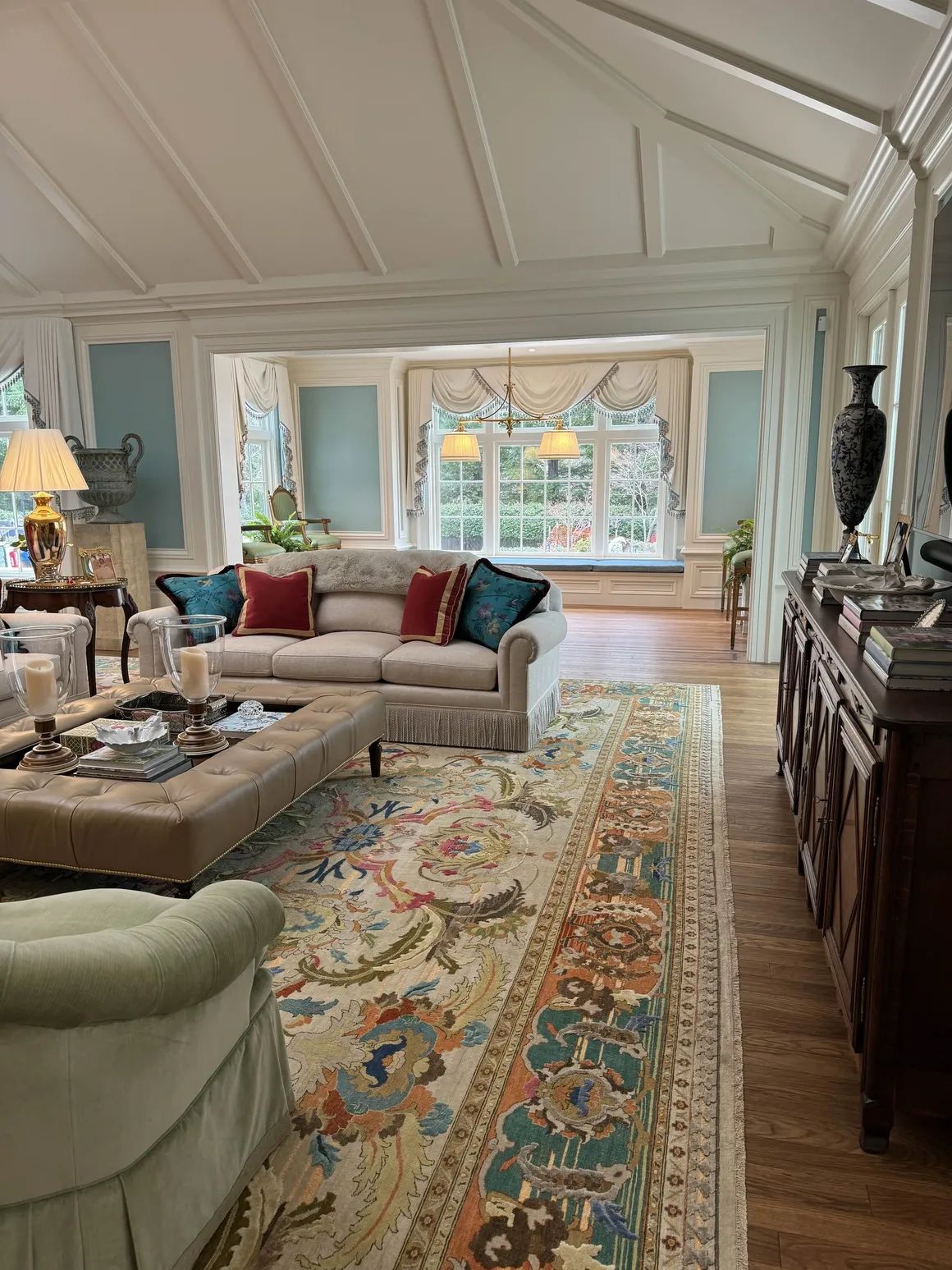 Living room with paneled walls and vaulted ceiling
